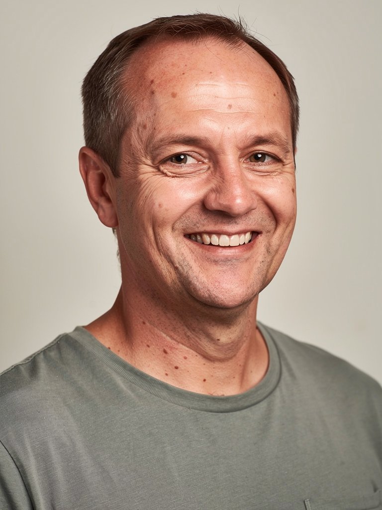 AI-generated studio portfolio photo of a White European man in his mid 40s