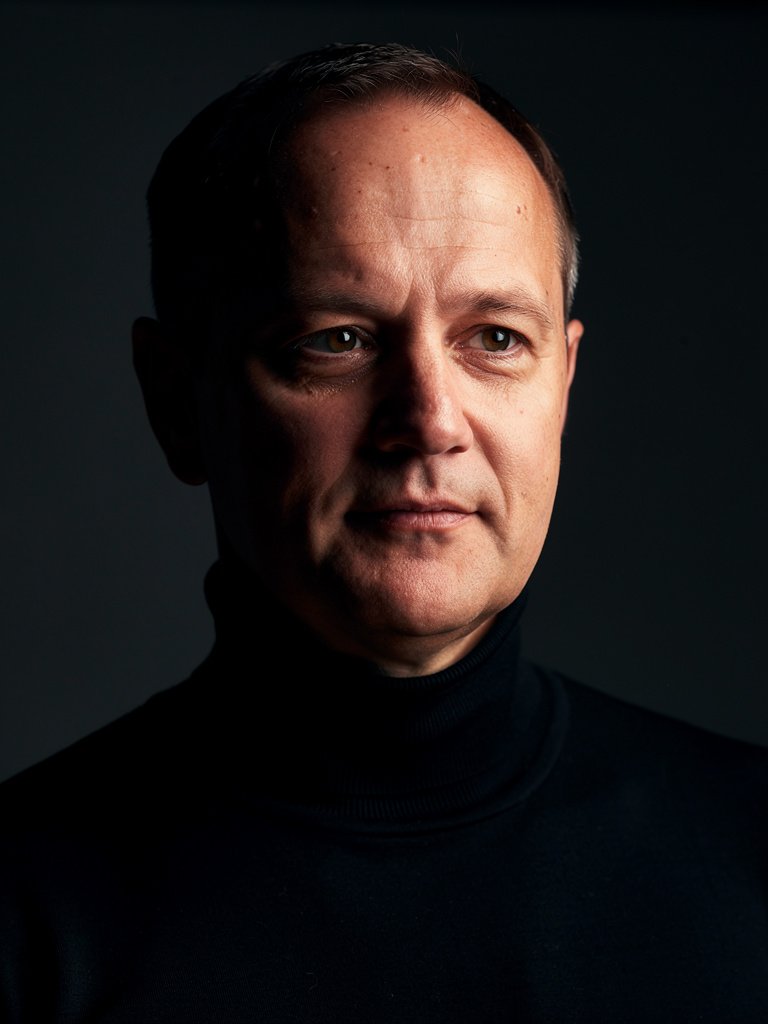 AI-generated tech founder portfolio photo of a White European man in his mid 40s